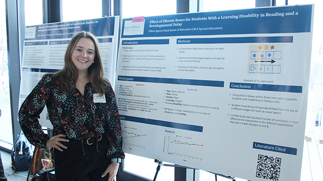 Olivia Agoros with her research poster at SASH