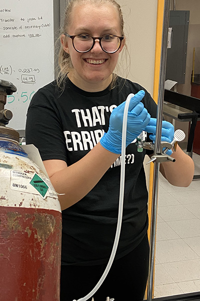 Senior Marion Olsen doing research in a lab 