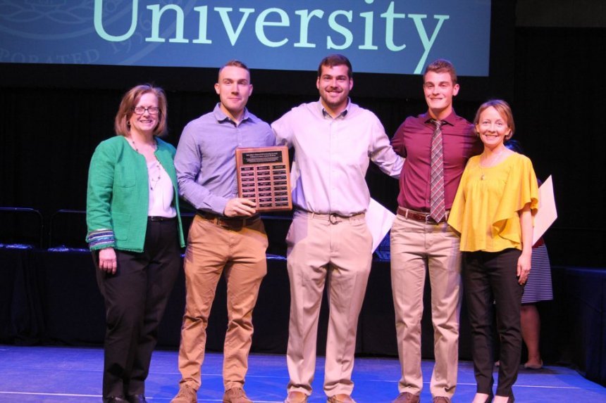 From left: 2018 Henderson Outstanding Tutor Award recipients Noah Pushor in writing, Andrew DelSanto in math, and Ryan Fontaine in science.  They are congratulated by Coordinator of Writing Center Karen Bilotti (far left) and Coordinator of Science Center Tracey McDonnell Wysor (far right).