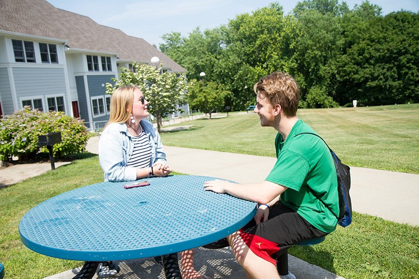 The grounds offer outdoor green space for grilling and socializing.