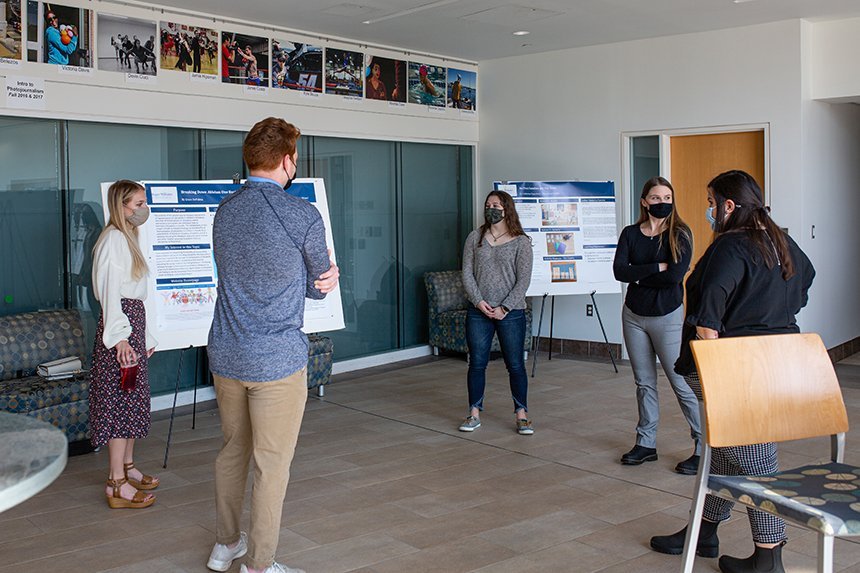 Students view posters