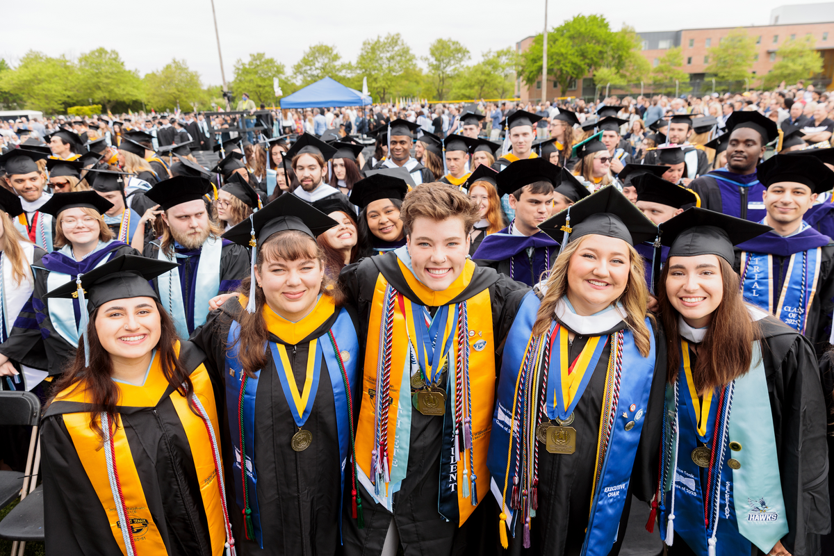 RWU Student Body President Zoey Cormican '25 at commencement with cords representing campus engagement