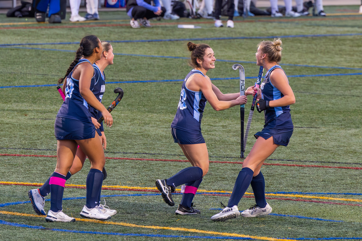 Field Hockey captain Chelsea King celebrates with her teammates as she surpasses the 200 career goal mark.