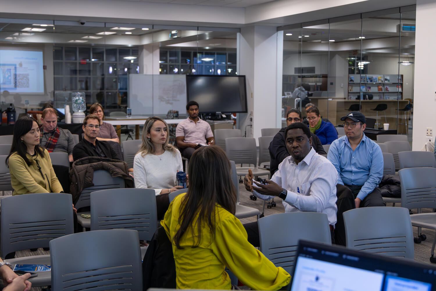 Faculty, staff, and administrators engage in discussion during the AI Symposium at the Mary Tefft White Cultural Center.