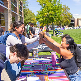 Students greet each other at the involvement fair