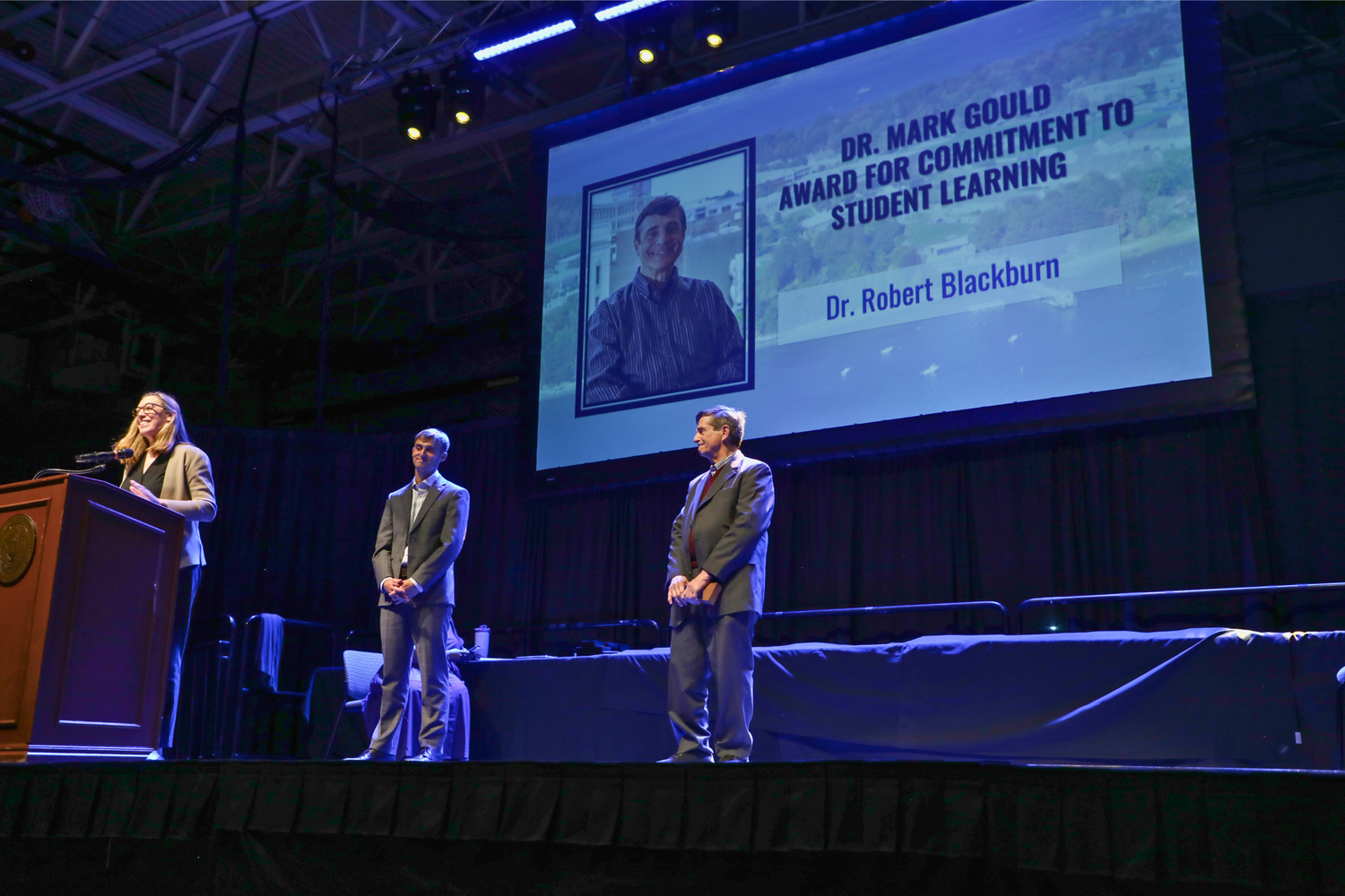 Professor of Philosophy Robert Blackburn is recognized by Provost Margaret Everett with the Dr. Mark Gould Award for Commitment to Student Learning.