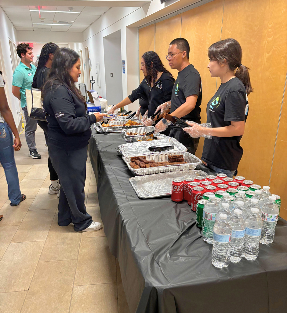 Students line up to sample food served during Noche Latina.