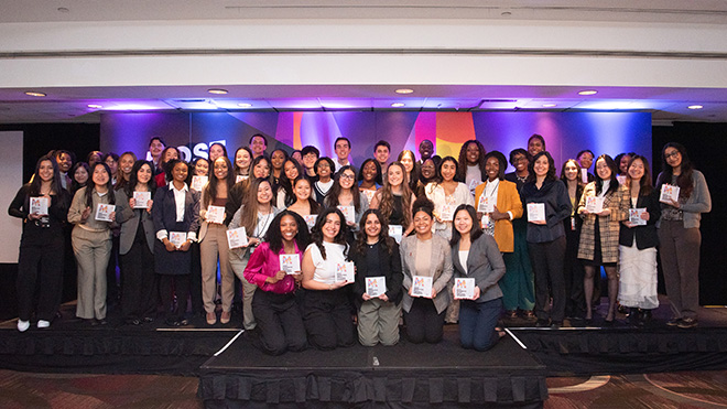 A photo of 50 college students posing at the AAF program