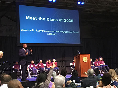 Executive Director Rudolph A. Moseley Jr. leads the third-grade class from a Providence STEM school in sharing their hopes of what they dream to become as the future Class of 2030.