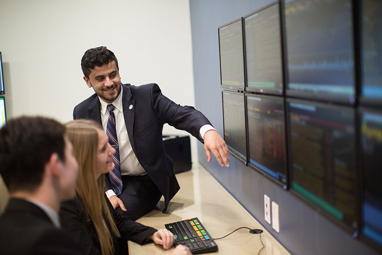 Students analyze stock trading data in Center for Advanced Financial Education.