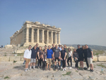 MBA students stand in front of the Acropolis