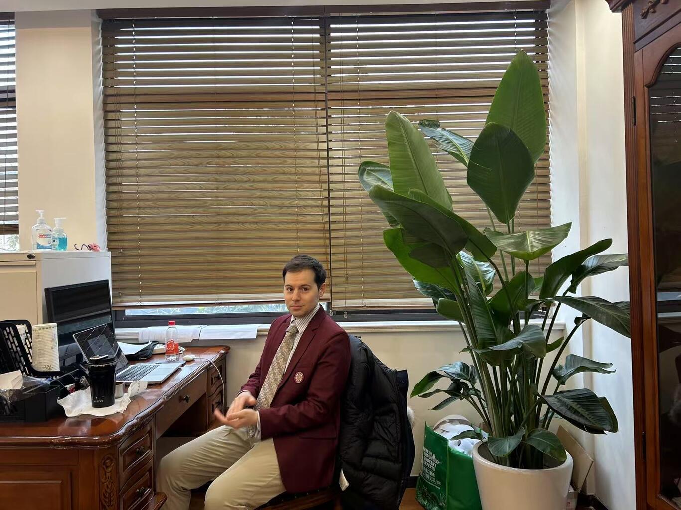 Kevin Spencer sits at his desk in an office