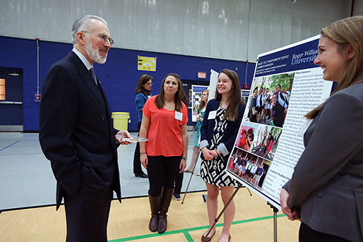 President Farish discusses a project with students.