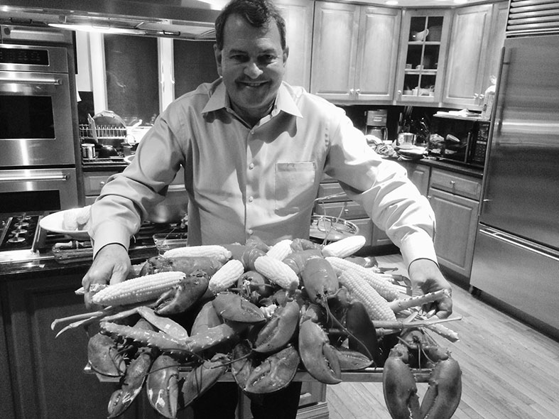 Miaoulis cooks lobster in his home kitchen.
