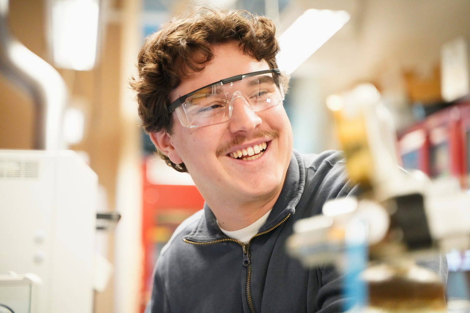 1. Junior Michael Natoli uses a direct mercury analyzer to measure mercury concentrations in fish tissue collected for his summer research.