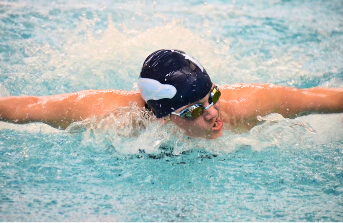 Then-senior Noelle Schneider competes for the RWU women’s swimming team during a home meet against Connecticut College.