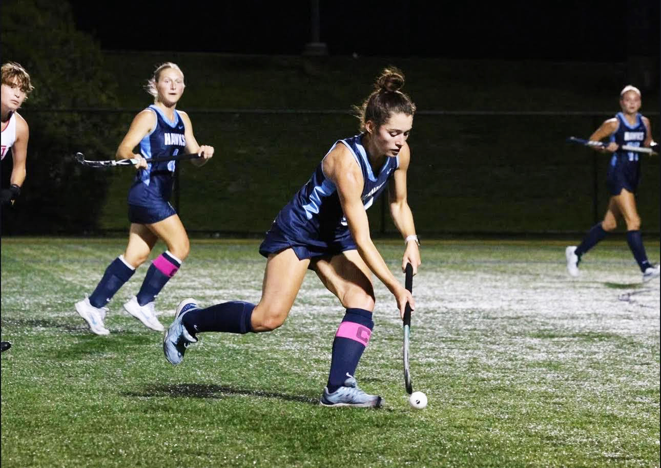 Field Hockey captain Chelsea King in action, leading her team with the same drive and determination that fuel her success in the classroom.