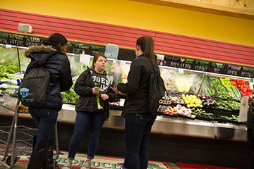 Students shopping at a grocery store.