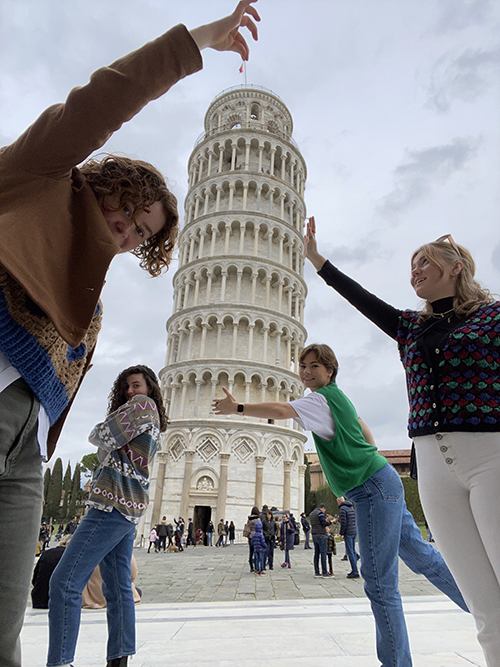 Architecture students in Italy with the Leaning Tower of Pisa. 