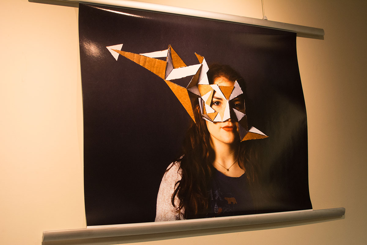 Photograph of an RWU student in a mask she made.