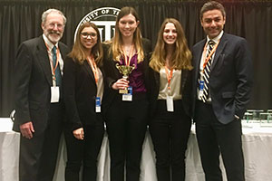 Analytics team and professors accept second place award.