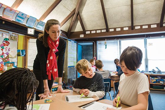 Student teacher in classroom.