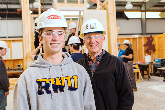 Student and professor in construction lab.