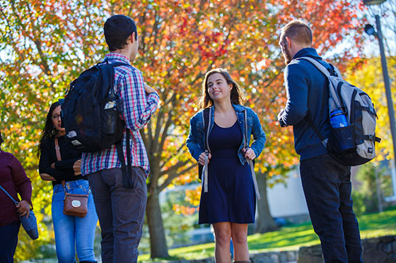 Students standing on campus.