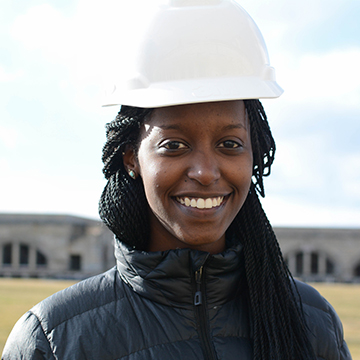 A headshot of Alexia Byusa wearing a hardhat