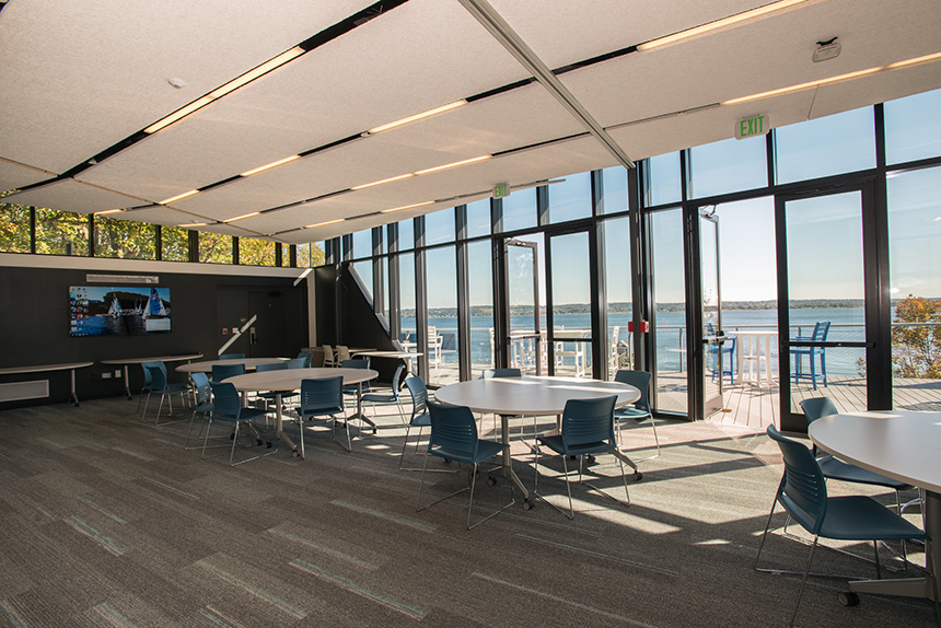 Conference room with a wall of floor-to-ceiling windows with bay views