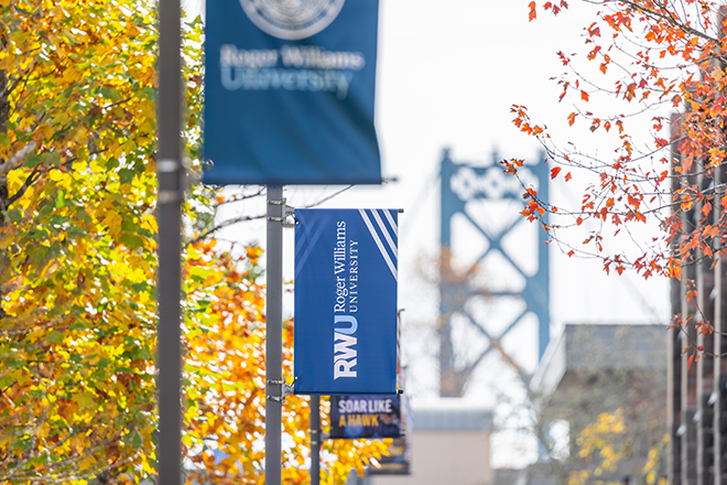 Fall campus scene with RWU flags