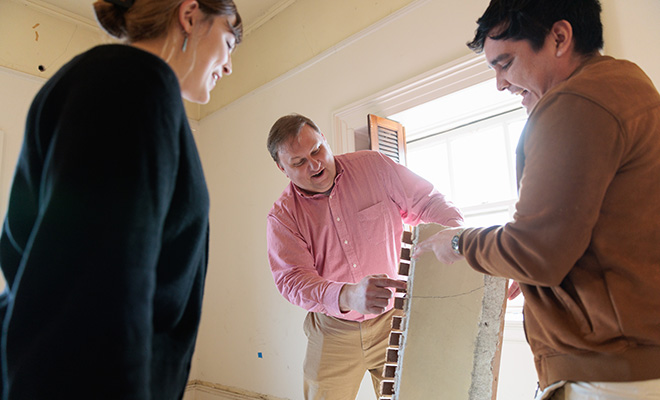 Architecture students learn from professor