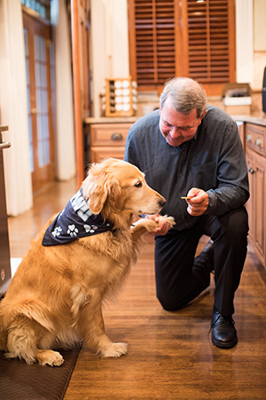 photo of President Miaoulis and his dog, Fletcher