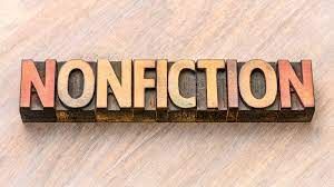 An image of the word "nonfiction" written in wooden blocks on a wooden table. 