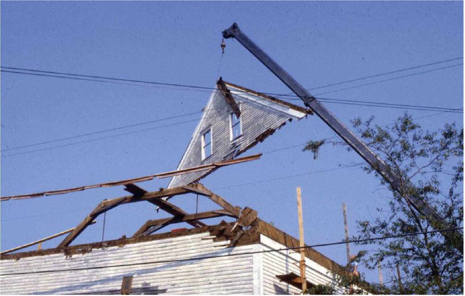 Roof of barn being disassembled
