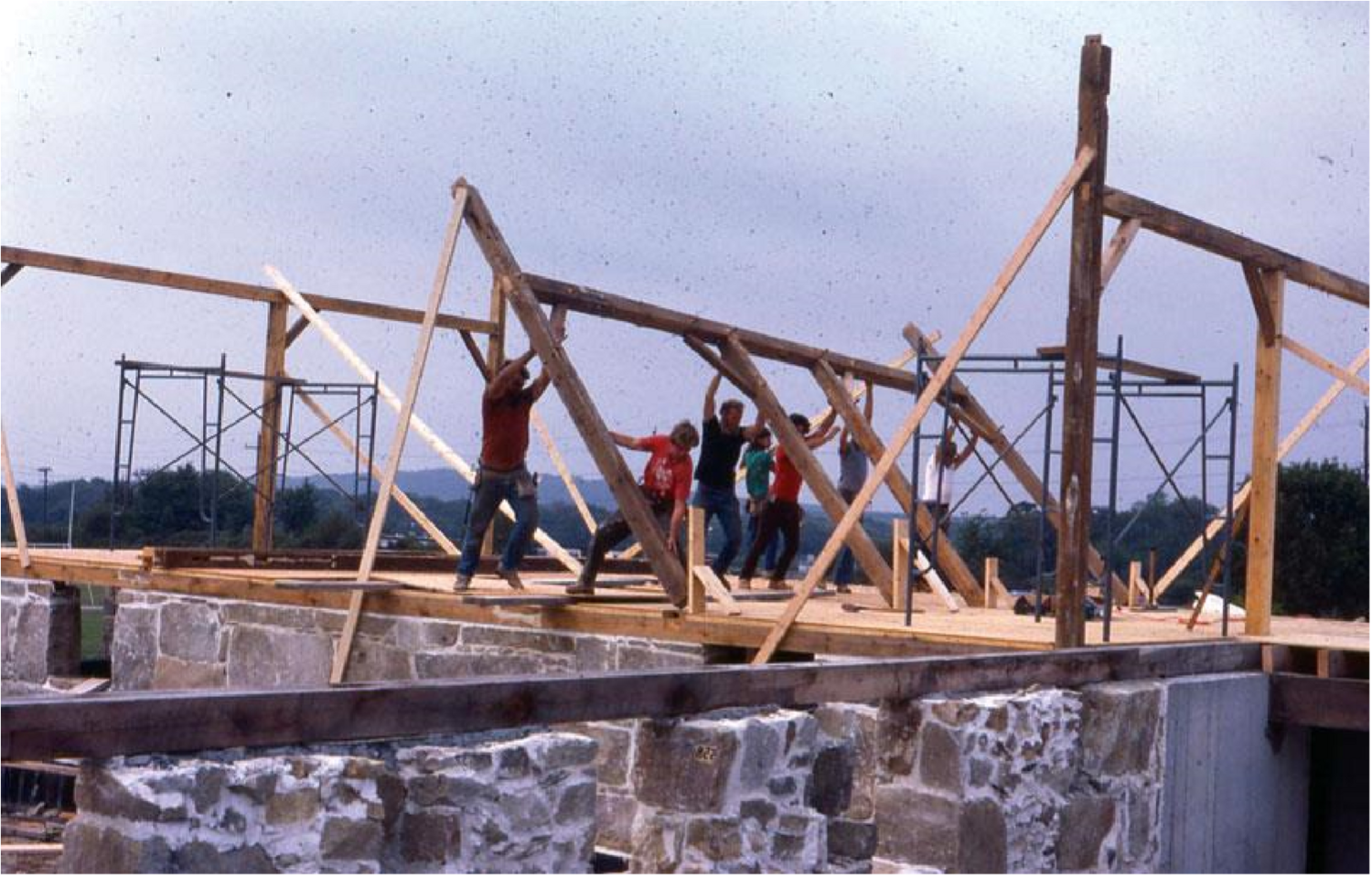 Students assembling the frame of the barn structure