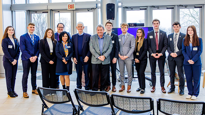 Mario J. Gabelli is joined by RWU students, faculty, and administrators in the GHH atrium