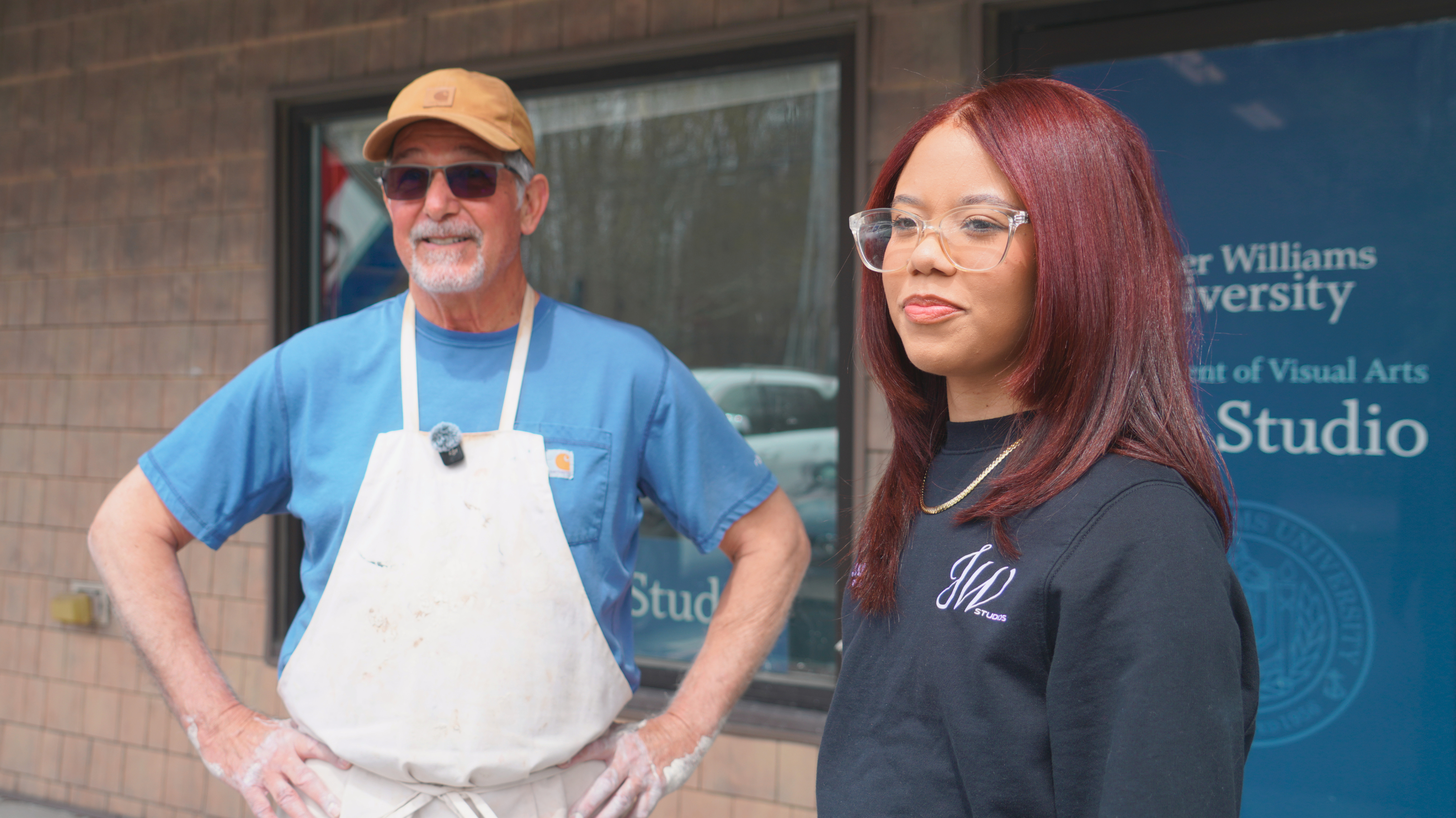 Roger Williams University Adjunct Professor Denis Leonti and junior Graphic Design major Juliet Garcia-Baez.