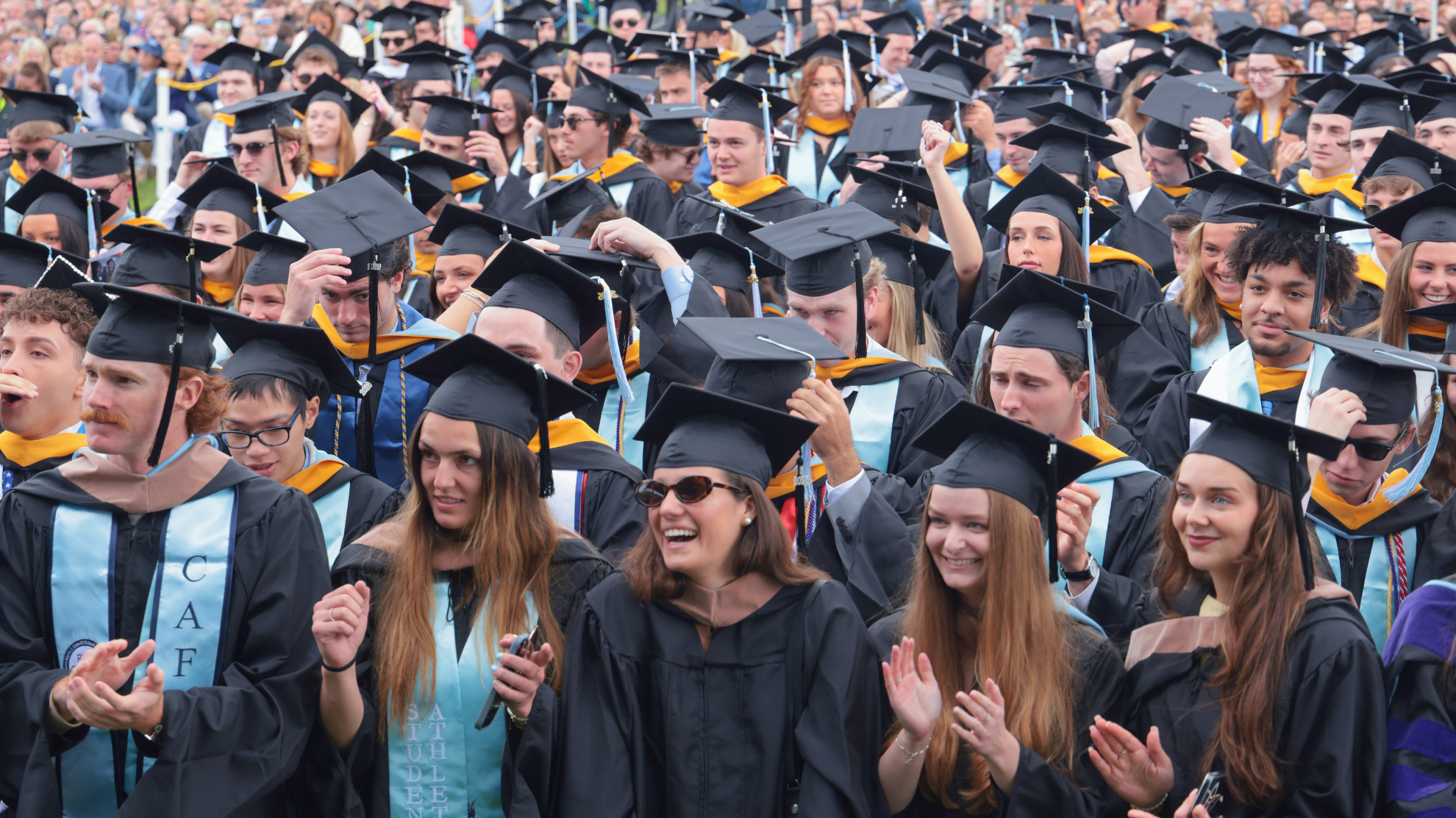 Soon to be graduates take their seats during the Commencement ceremony.