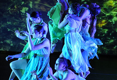 A picture of dancers in a performance.