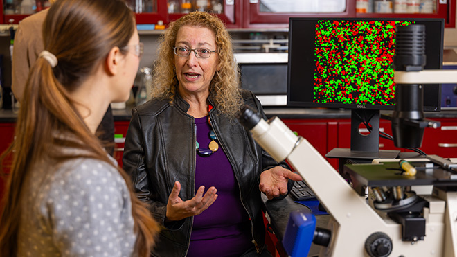 Professor Avelina Espinosa speaks with a student.