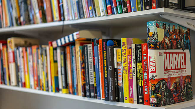 A row of superhero books on Annika Hagley's shelf 