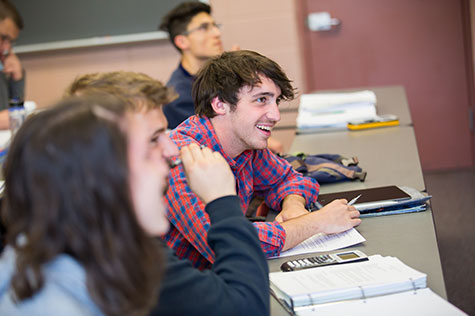 A student smiling in class
