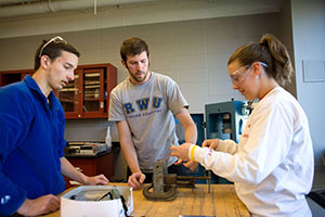 Engineering students work on project.