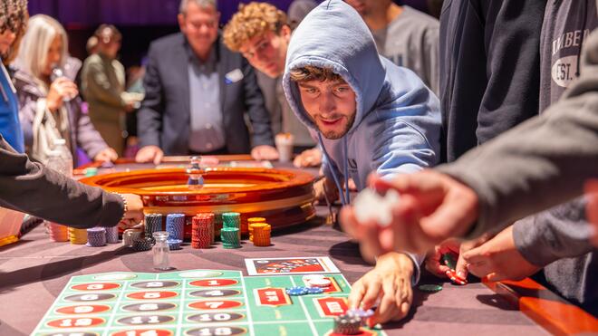 Students playing at Casino Night.