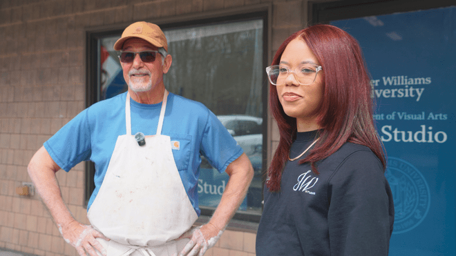Roger Williams University Adjunct Professor Denis Leonti and junior Graphic Design major Juliet Garcia-Baez.