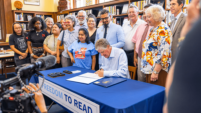 Gov. McKee signing the Freedom to Read Act