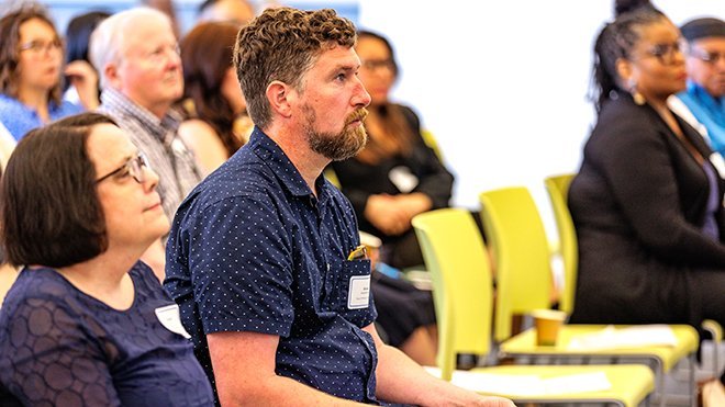 An audience sitting down at the Providence Public Library