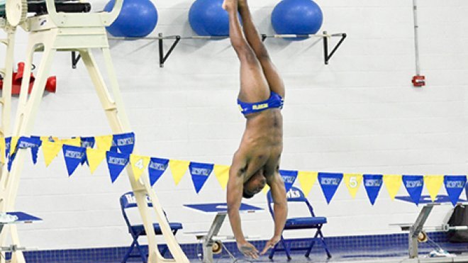 image of Josh Seabrook diving into the pool, inches above the surface