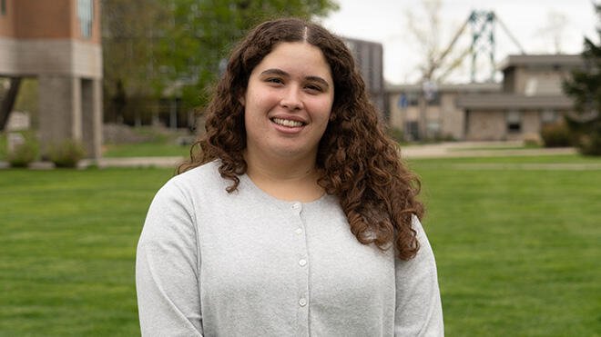 Kaicey Rosa standing in the RWU quad.